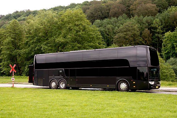 Black Travel bus standing in a country road